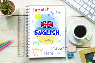 Hand writing on a notebook in a language class with the word 