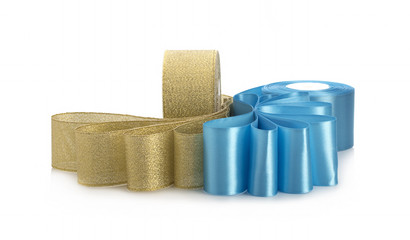 Blue and gold satin ribbons on a white background for gift wrapping