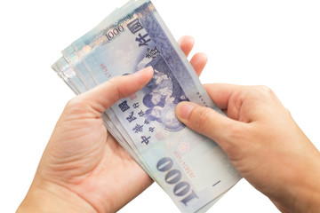 Hands with Taiwan money on isolate white background.