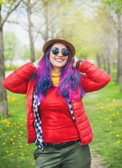 Young beautiful fashion hipster woman with colorful hair