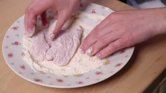 Breaded chicken breasts in flour 