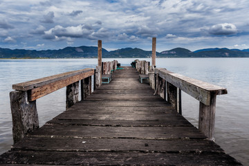 Fototapeta premium Old wood pier at Lago di Massaciuccoli