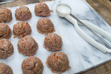Meatballs preparation using ice cream scoop, easy trick, white marble cutting board