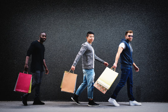 Three Guys Shopping- Men Shopping In Urban Setting