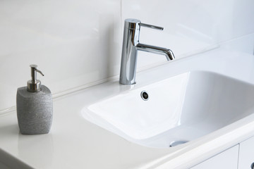 modern and clean toilet, sink and toiletries - 158504781
