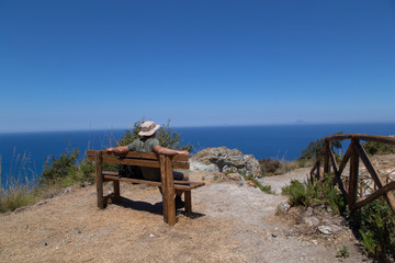 Young hiker enjoying landscape; Sentiero Naturalistico Calavà