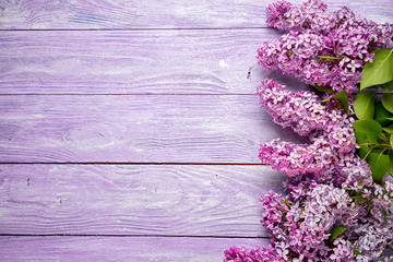 lilac frame at the side of the wooden background with copy space