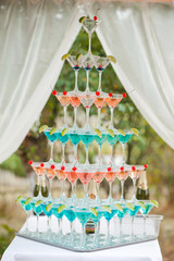 Background of glasses with cocktails and lime