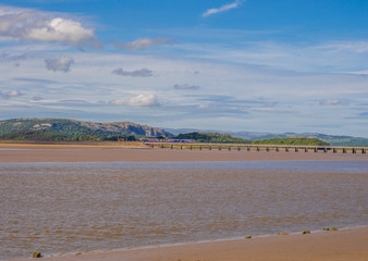 Picturesque viaduct across the Kent estuary at low tide, Arnside, Lancashire, UK