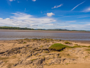Rocky shore uncovered at low tide at Arnside, Lancashire, UK