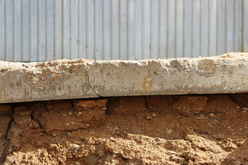 The concrete slab lies on a platform under a layer of sand. Different levels of.