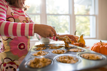 Young girl home baking