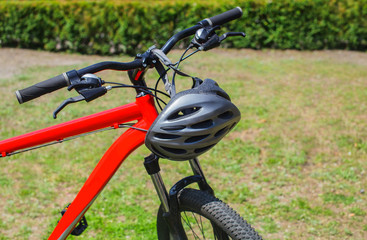 The front part of the bicycle is red-wheel, wheel and frame close-up.