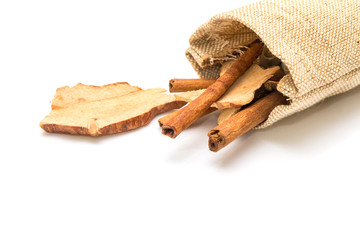 Cinnamon stick and dried ginger in sack with spices