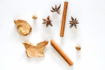 Top view of cinnamon stick and dried ginger isolated on white background
