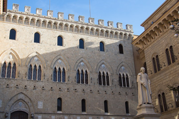 Fototapeta na wymiar Facade detail of the Salimbeni Palace, Banca Monte dei Paschi di Siena. Siena, Tuscany, Italy.