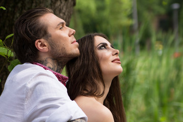 Fototapeta premium Couple in love. Guy with girl in nature.