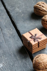 Walnuts and a gift on the table