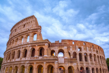 Fototapeta na wymiar Front view of Roman Colosseum with dramatic sky