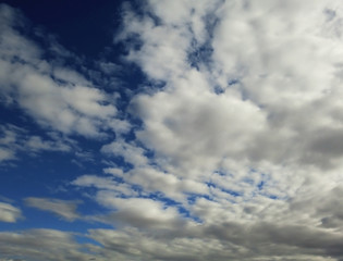Overcast smooth clouds texture on blue day sky background