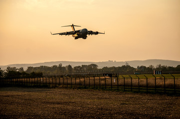 Fototapeta na wymiar Airplane silhouette in the sunset (Brno Airport, Czech Republic)