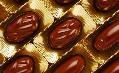 chocolate candies in a gold gift box