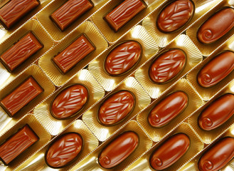 chocolate candies in a gold gift box