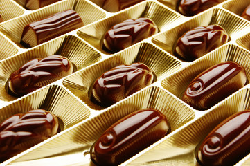 chocolate candies in a gold gift box