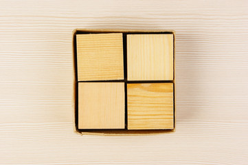 wooden geometric cube in a box