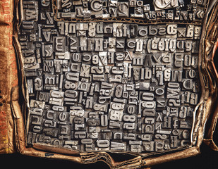 metal letters in a cardboard box