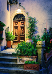Fototapeta na wymiar Entrance to the old Italian house at night.