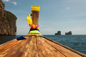 Traditional Thai Longtail boat and island of Phi Phi Leh on the horizon,Thailand