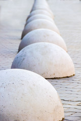 Concrete hemisphere on the sidewalk