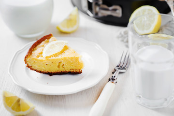 Desserts and pastries, sweet food, lemon biscuit pie with milk on a light wooden background 