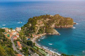 Fototapeta na wymiar Taormina, Sicily - Beautiful landscape view of Mazzaró beach and turquoise sea water