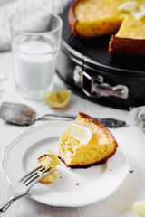 Desserts and pastries, sweet food, lemon biscuit pie with milk on a light wooden background 