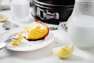 Desserts and pastries, sweet food, lemon biscuit pie with milk on a light wooden background 