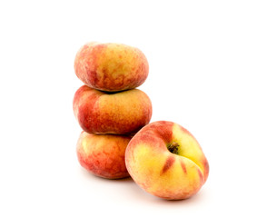 Flat peaches on a white
