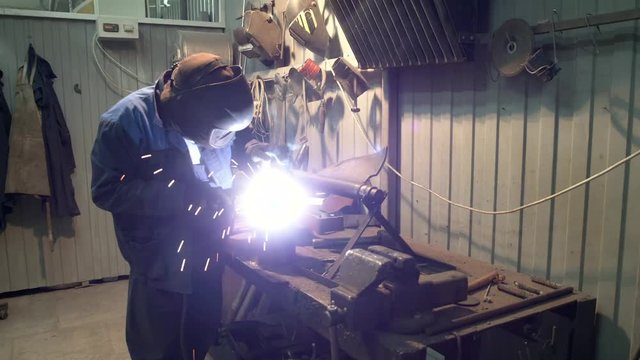 The job of a welder at a manufacturing plant