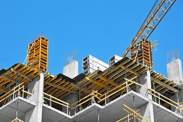 Crane and highrise construction site