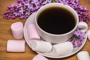 Good morning! Lilac flowers and coffee