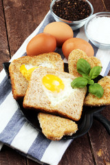 fried eggs and toast with basil pepper and salt