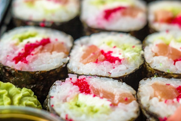 The plate of sushi with soy sauce, wasabi