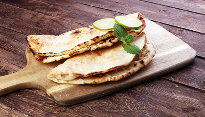 Delicious kebab sandwiches on wooden table