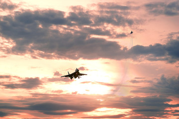 Fototapeta na wymiar Soviet fighter and sunset