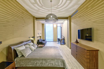 Russia, Moscow - modern designer renovation in a luxury building. Stylish bedroom interior with double bed.

