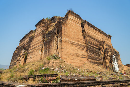 Ruins of the uncompleted Mingun Pahtodawgyi monument stupa in Mingun near Mandalay in Myanmar. Viewed from the side.