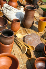 Lots of handmade clay pot, bowl and mug. Ceramic clay kitchen utensils, bowl at street handicraft market