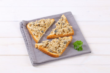 toast with grated cheese and olive spread