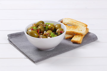 marinated green olives with toast